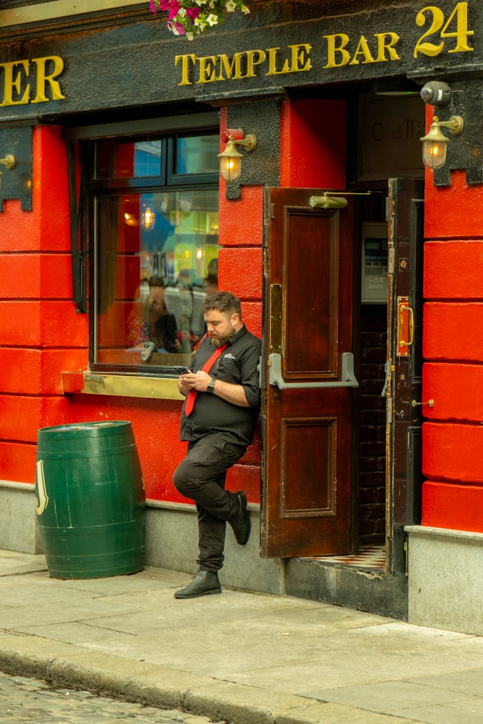 Free stock photo of black shirt, break time, checking phone